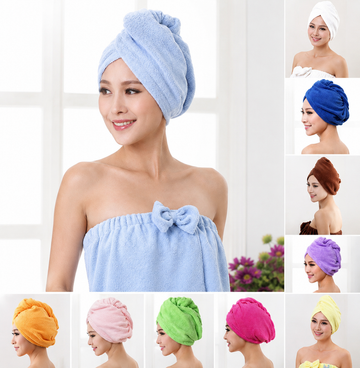 Woman wearing a blue towel with multiple color options displayed around her.