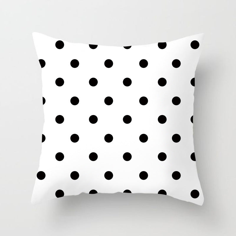 Geometric throw pillow cover on modern sofa