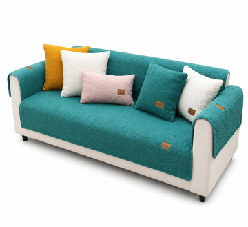 Teal sofa with colorful cushions on a white background